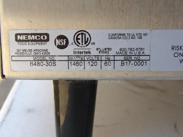 Nemco 6480-30S commercial stainless steel heated display case back view, showing label with model and specifications. Powered on.