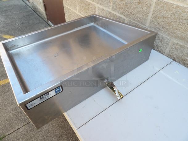 RSI Table Top Cold Well with ball valve, stainless steel, rectangular, used, visible label, corner seam, on outdoor surface.