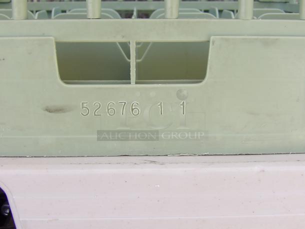 Vollrath 52676-11 dishwasher rack, 16-hole, light wear, visible model number, pale green plastic.