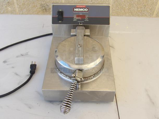 Nemco Waffle Maker, Model 7030A, stainless steel, 120V, features on/off switch, visible power cord, good condition.
