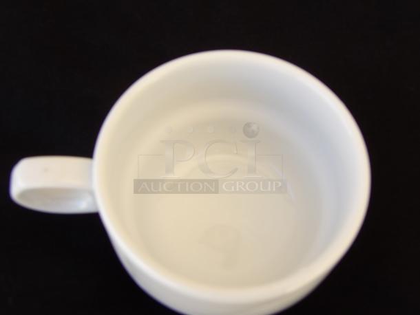 Delco Royal Cermaicor Porcelain cup, 7.0 oz, white, top view showing interior and handle, in pristine condition.