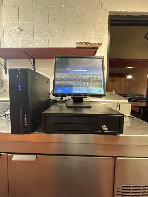 Point of sale system with cash drawer, Windows 7 OS, display monitor, and cables, featuring lock and secure bill slot.