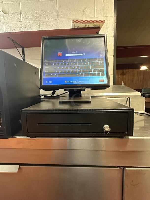 Point of sale system with cash drawer, running Windows 7. Includes NEC monitor, cables, and key lock feature.