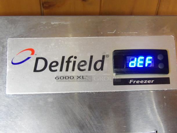 Delfield 6151XL-S two-door reach-in freezer, excellent condition, digital display indicating "DEF," tested and working.