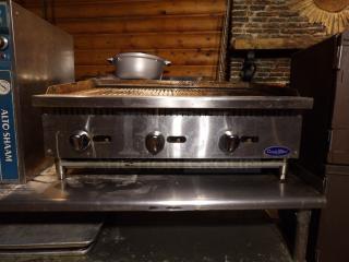 Cook Rite ATRC 36 stainless steel gas char broiler with back and side splashes, on legs; features three control knobs.