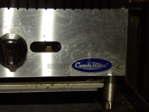 2022 Cook Rite ATRC 36 stainless steel char broiler grill with back and side splashes, on legs, natural gas powered.