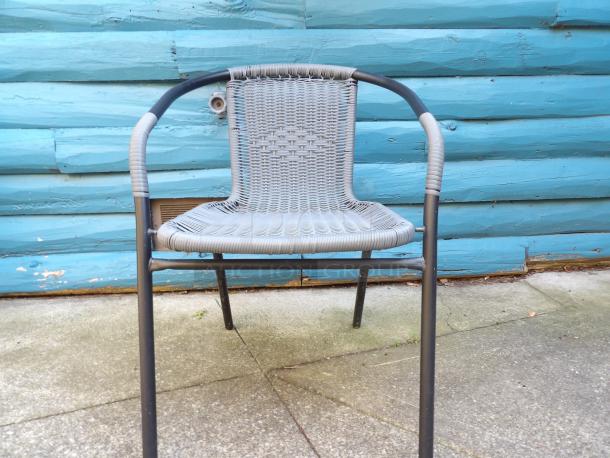 (x2) Like new black metal mesh patio armchairs with woven backrest. Durable, modern design for outdoor use.