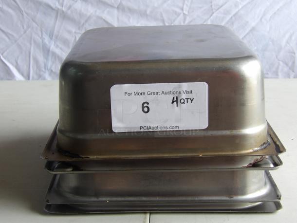 (4) Commercial stainless steel steam table pans, stacked. Label indicates quantity of 4. Suitable for hotel or catering use.