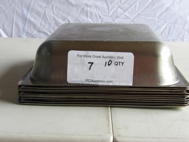(x10) Commercial stainless steel steam table pans stacked; label shows "10 QTY" and auction info. Good condition.