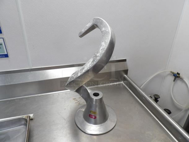 Dough hook for 80 Qt. Hobart mixer, metal construction, used condition with slight wear, ideal for heavy-duty mixing.