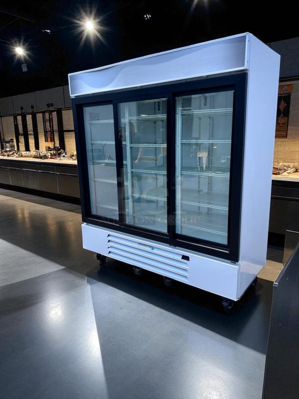 Beverage-Air MMR66HC-1-W 78" triple glass door merchandiser refrigerator in excellent condition, 115V, fully tested.