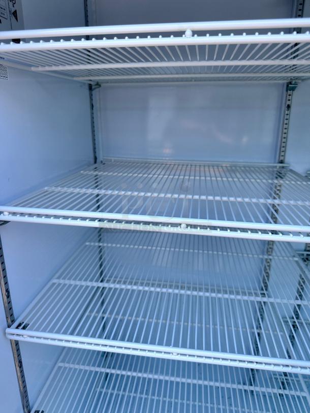 Beverage-Air MMR66HC-1-W triple glass door merchandiser refrigerator, excellent condition, interior shelves visible.