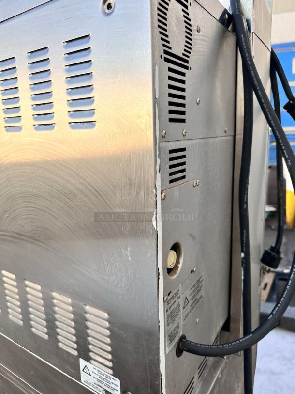 Moffat E32MS double deck convection oven, excellent condition, 208V, vented side view with visible warning labels and cords.