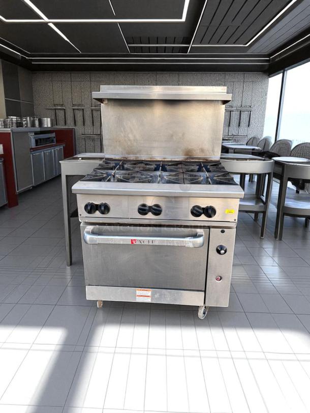 Wolf 36C-Y1R gas range with six open burners and standard oven, excellent condition, fully tested, natural gas.