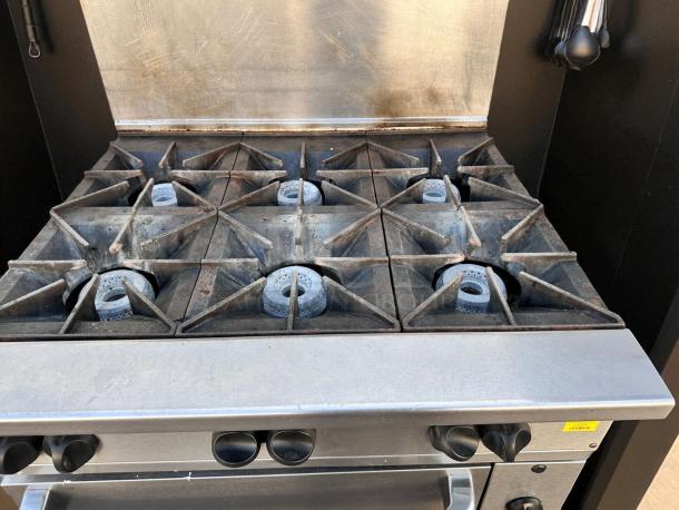 Wolf 36" gas range, model 36C-Y1R, with 6 open burners and standard oven. Natural gas, excellent condition, fully tested.
