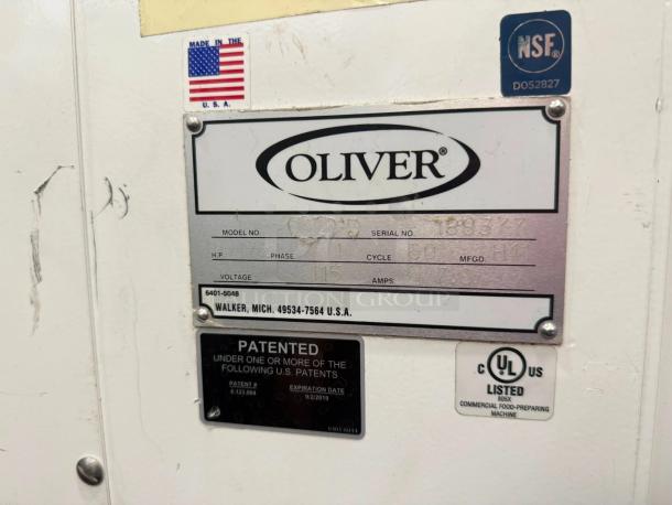 Oliver 6401-5048 commercial bread slicer, NSF certified, made in USA. Features model and patent labels. Fully tested, excellent condition.