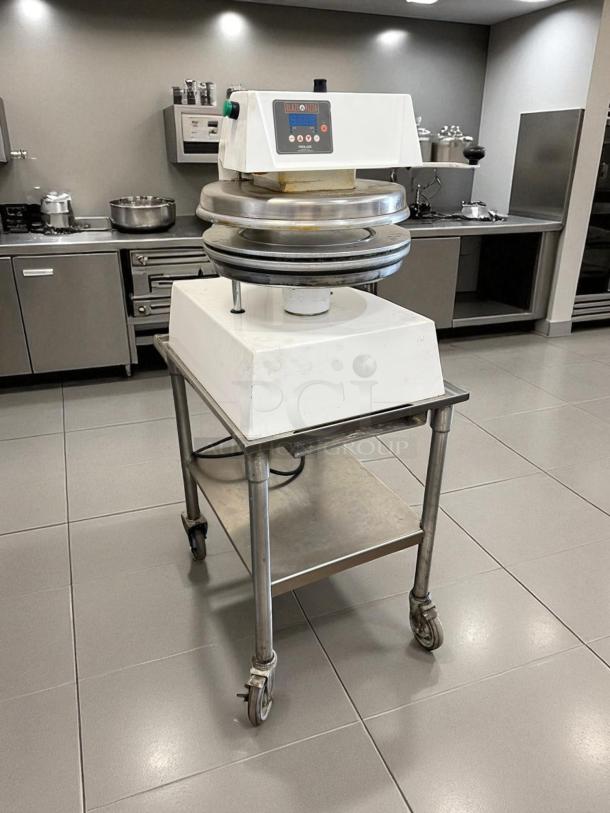 Proluxe DP2350 manual heated pizza dough press, 18" plate, 208V, in outstanding working condition, fully tested.