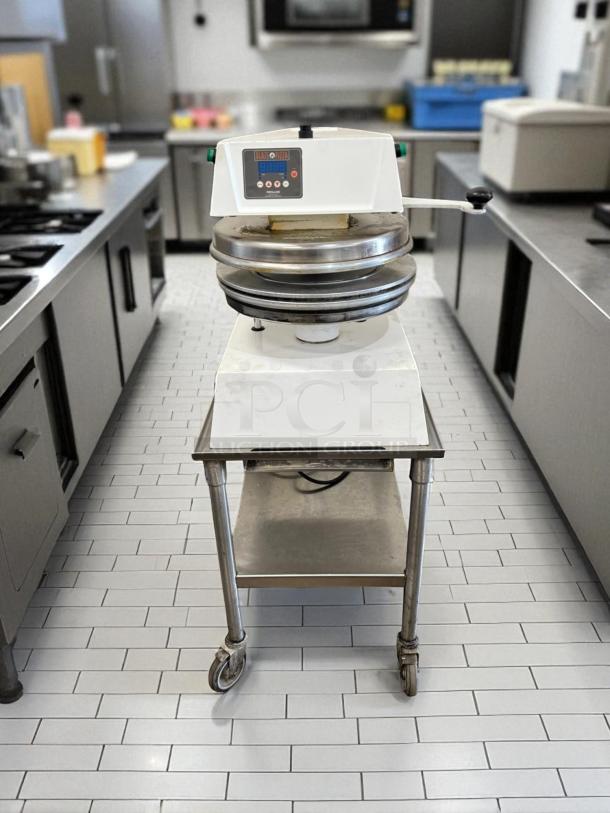 Proluxe DP2350 manual heated pizza dough press with 18" plate, in outstanding working condition, 208V, fully tested.