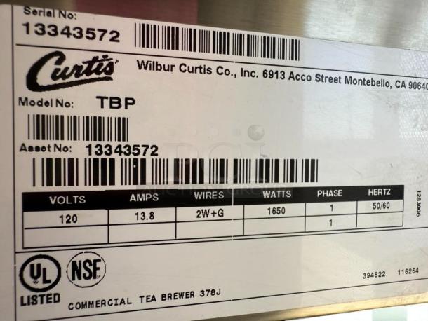 Curtis TBP iced tea brewer label showing model, serial number 13343572, 120V, 1650 watts, UL listed. Pristine condition.