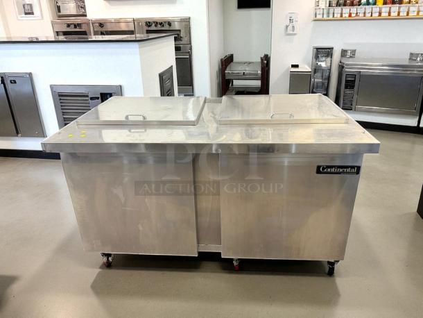 Continental SW60-24M commercial refrigerator freezer, dual lid top access, excellent condition, 115V, fully tested, on casters.