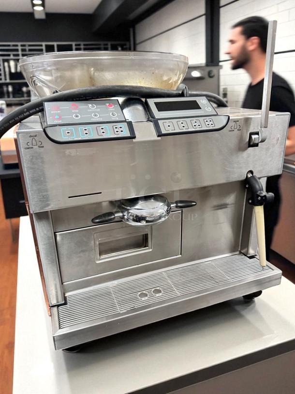 Carimali Eco Super-Automatic espresso machine with dual group heads and steam wand, in outstanding condition, fully tested.