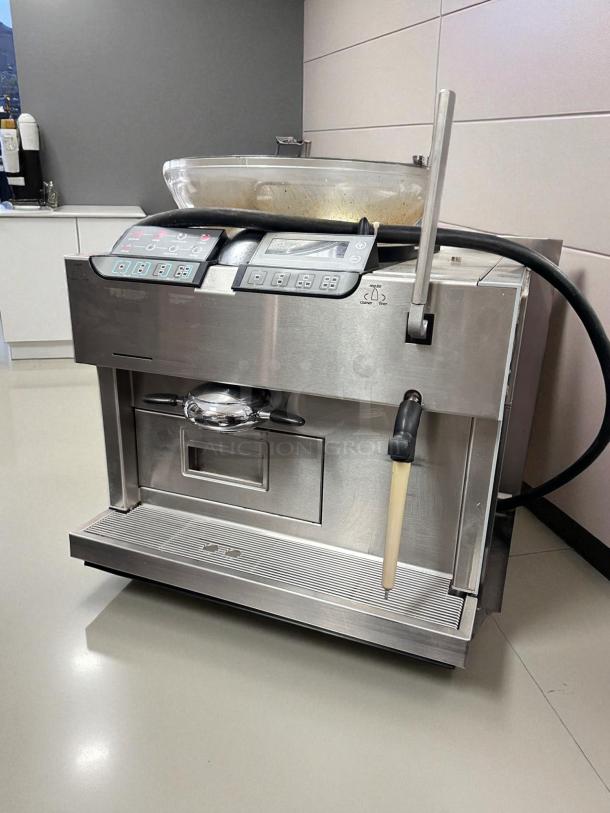 Alt text: Carimali Eco Super-Automatic Espresso Machine with dual group heads and steam wand in outstanding condition. Fully tested and working.