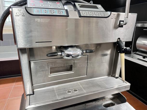 Carimali Eco Super-Automatic Espresso Machine in outstanding condition, features dual group heads, steam wand, and control panel.