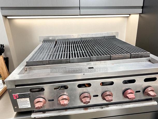 Wolf Range Co. commercial gas charbroiler with 6 burners, natural gas, stainless steel, excellent condition, fully tested.