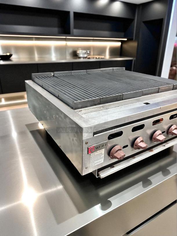 Wolf Range Co. 6-burner gas charbroiler, natural gas, great working condition, fully tested, visible branding and control knobs.