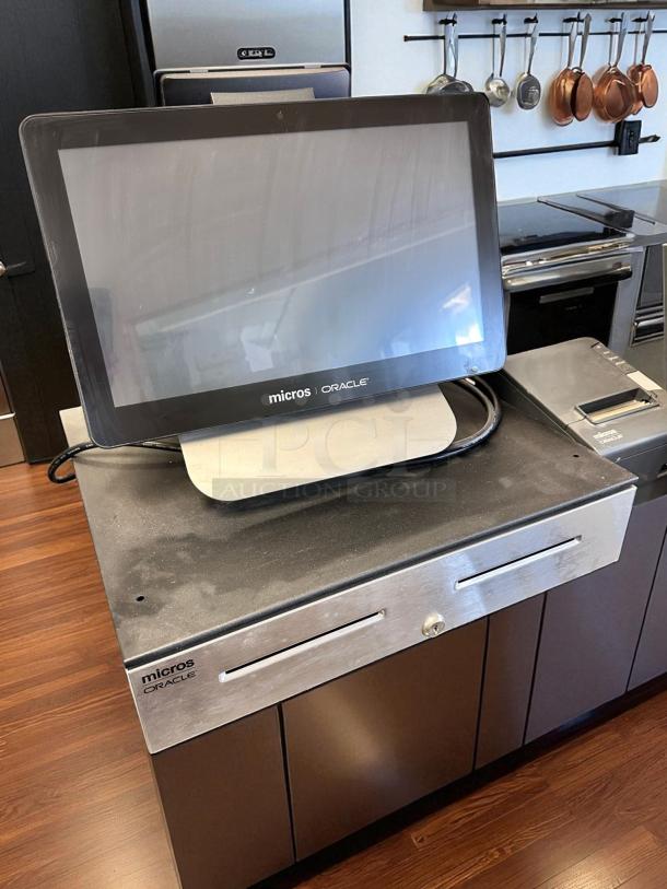 Oracle Micros RES 3700 POS System with touchscreen, cash drawer, and power dock. Fully tested, top-tier condition.