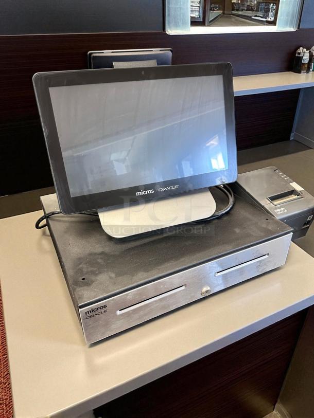 Oracle Micros RES 3700 POS System with touchscreen terminal, cash drawer, and power dock. Fully tested, excellent condition.