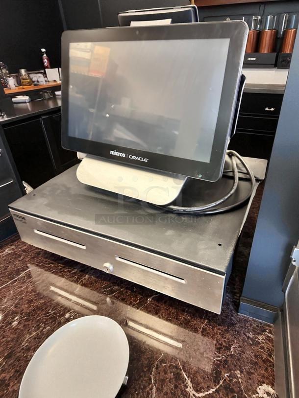 Oracle Micros RES 3700 POS System with touchscreen terminal and cash drawer. Excellent condition, fully tested, with power dock.