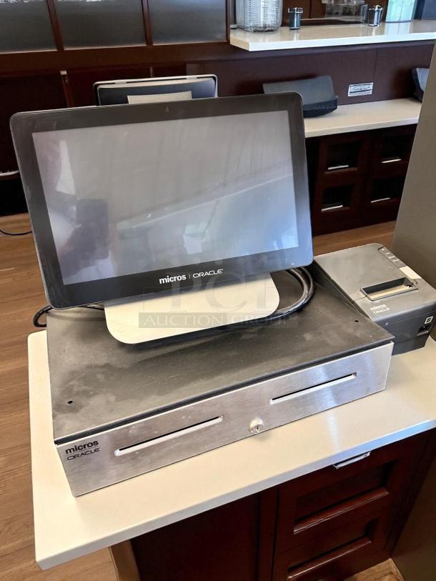 Oracle Micros RES 3700 POS system with touchscreen terminal, cash drawer, and power dock, fully tested and working.