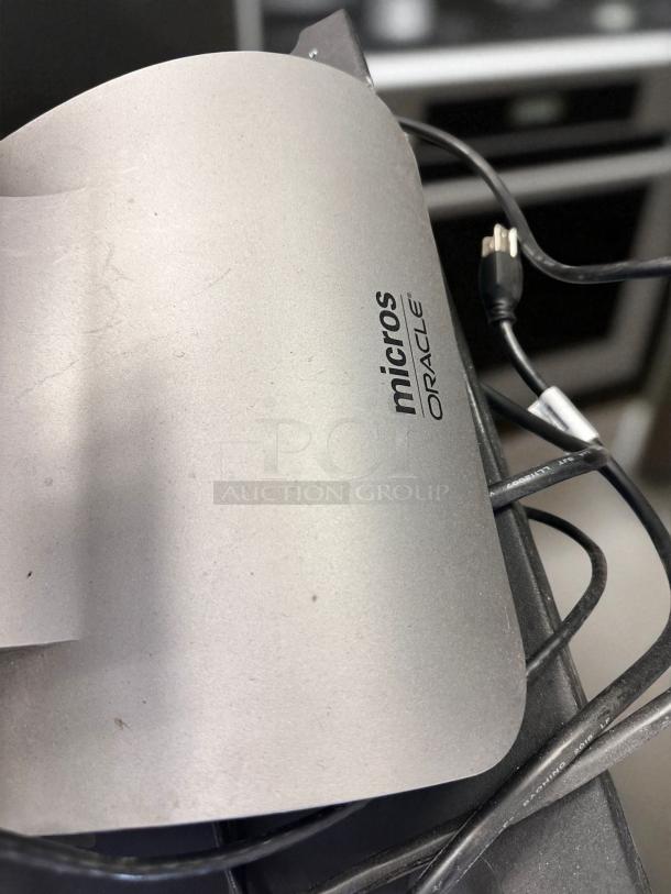 Oracle Micros RES 3700 POS System, silver panel with visible logo, power cables, fully tested and working condition.