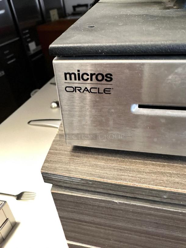 Oracle Micros RES 3700 POS system with visible branding. Includes touchscreen terminal, cash drawer, and power dock. Fully tested and functional.