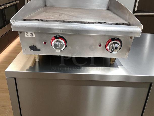 Commercial 24" manual gas griddle in outstanding condition, countertop model, fully tested and working, with control knobs.