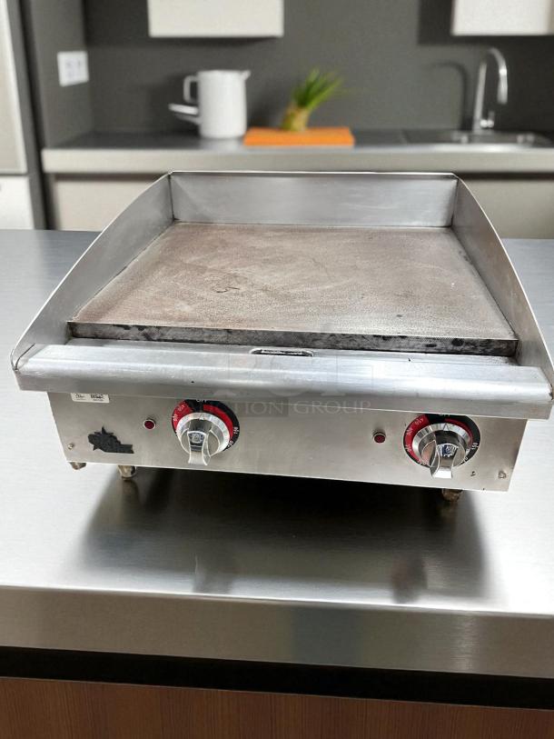 Commercial 24" manual gas griddle in outstanding condition, tested and working. Stainless steel, dual control knobs.