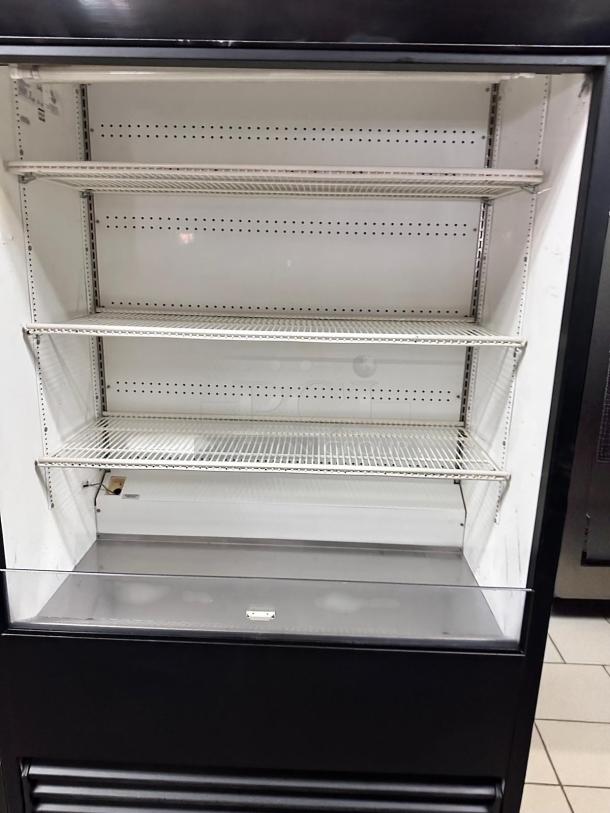 True TAC-48 air curtain display merchandiser, 48", excellent condition, 208/230V, fully tested, white interior with metal shelves.
