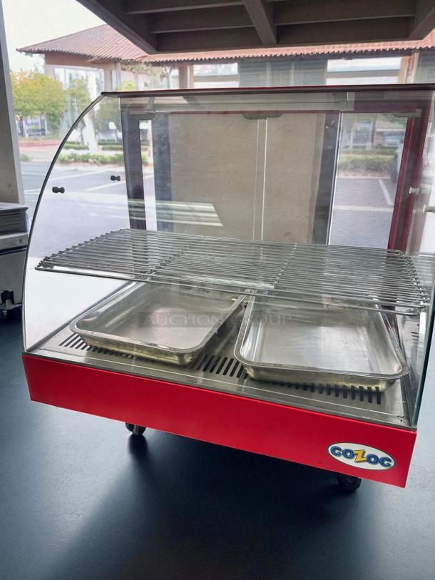 Cozoc FW5004-2 27" countertop heated display case in superb condition, red base, dual trays, clear glass front, 120V.