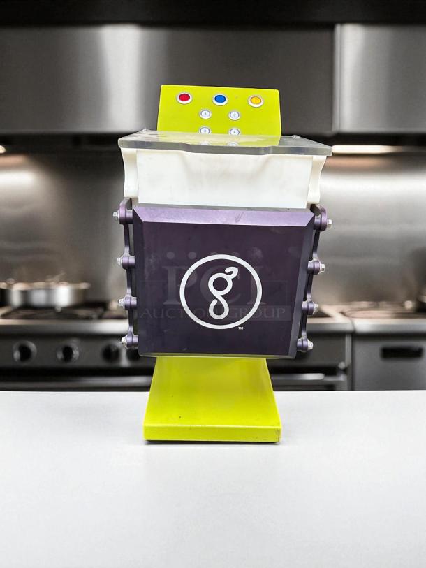 Goodnature CT7 cold press juicer in superb condition, tested and working, 115V. Lime green base, control panel with colored buttons.