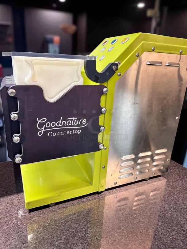 Goodnature CT7 Cold Press Juicer, superb condition, 115V, fully tested and working, vibrant yellow and silver design, countertop model.