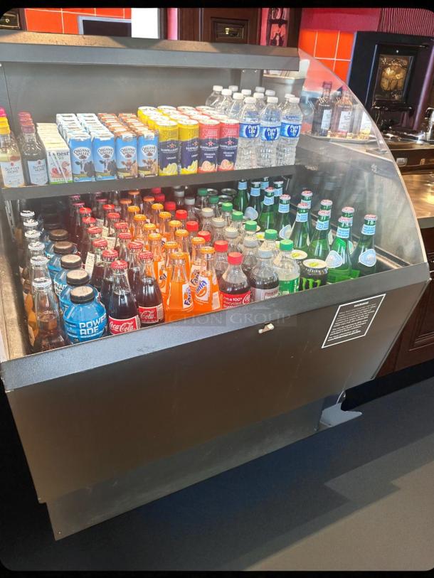 Commercial-grade 36" wide open-air beverage display refrigerator in outstanding condition, fully stocked and tested.