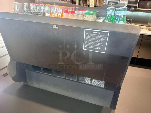 Commercial Grade 36" beverage display refrigerator, outstanding condition, fully tested, open air design, warning label visible.