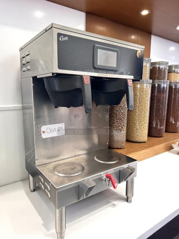 Wilbur Curtis G4GEMT10A1000 dual automatic coffee brewer, outstanding condition, tested, 220V, stainless steel finish.