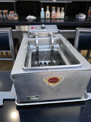 Brand-new Wells countertop single-well electric fryer, 120V, NSF certified, stainless steel, visible Wells logo and control knob.