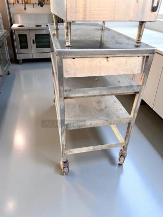 Superb condition stainless steel 3-tier utility prep table on casters, dimensions 18" x 36" x 34.5", cleaned and tested.