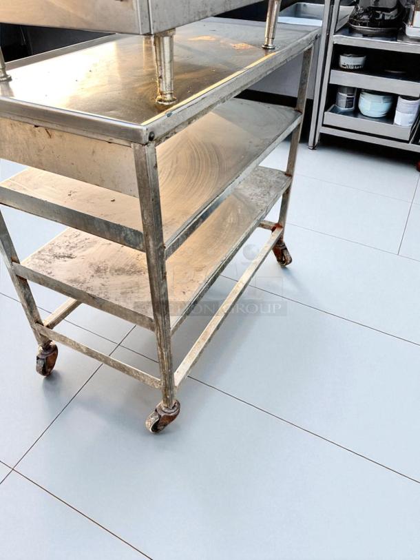 Stainless steel 3-tier utility prep table, 18"x36"x34.5", on casters. Cleaned, tested, superb condition. Commercial-grade.