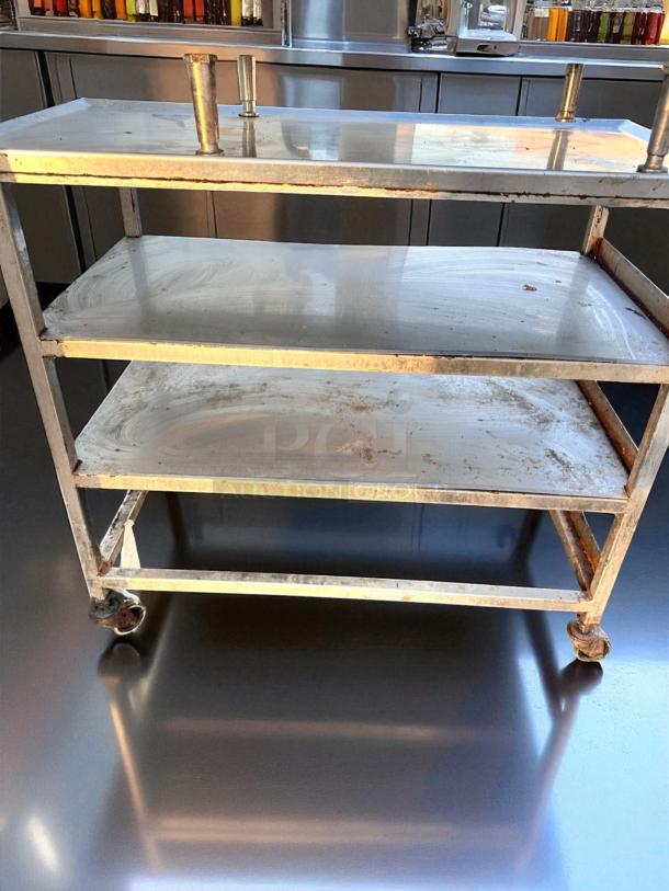 Stainless steel 3-tier utility prep table on casters, 18"x36"x34.5". Superb condition, cleaned and tested, ideal for commercial use.