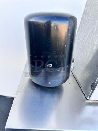 Tork H2 black paper towel dispenser, wall-mountable, commercial grade, superb condition, tested and functional.