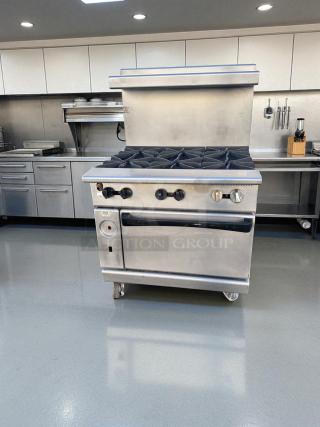 Vulcan V36 gas range, 36" with 6 open burners and standard oven. Superb condition, stainless steel finish, fully tested.